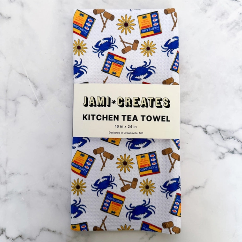 Kitchen tea towel with crab and box design on a marble background