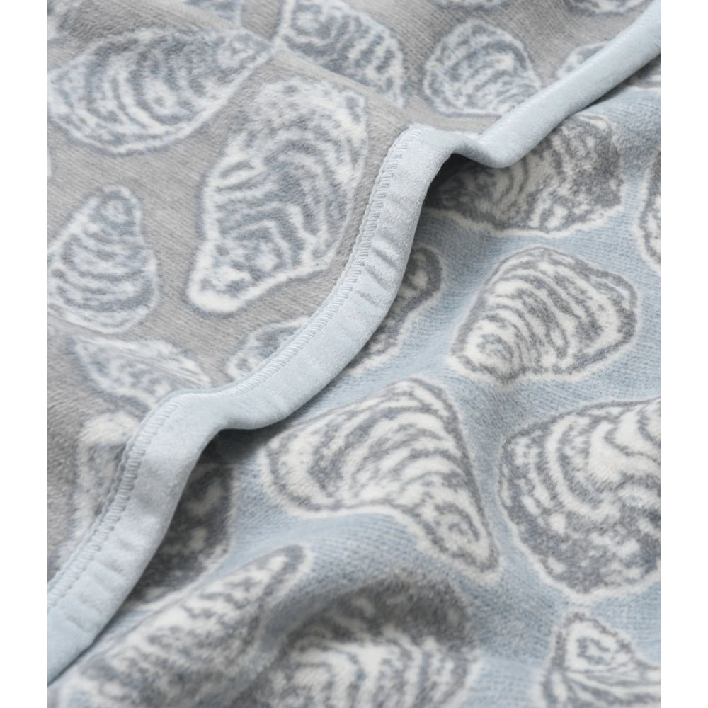 Gray textured blanket with shell pattern