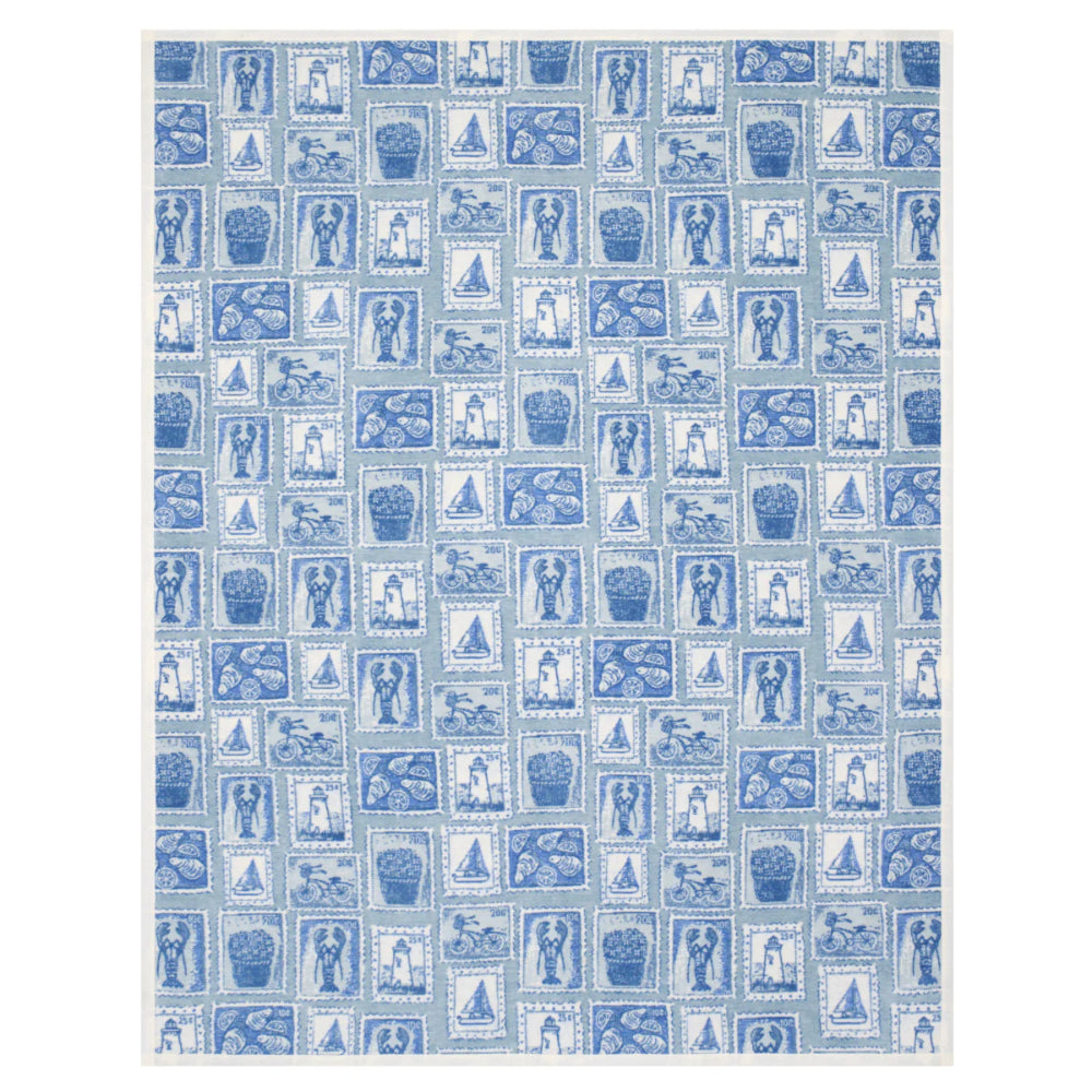 Patterned blanket with blue and white stamp design on a white background