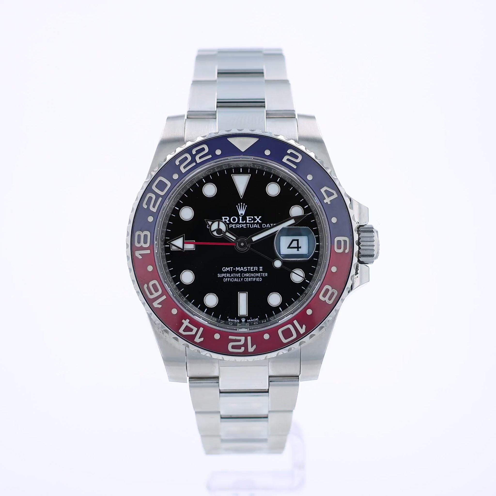 360 degree video of a stainless steel Rolex GMT II watch with a blue and red bezel and black dial on a white background