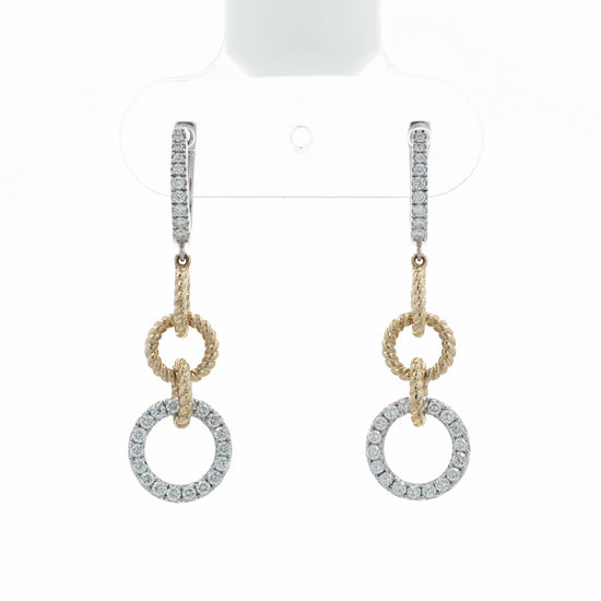 A video depicting pair of gold and silver drop earrings with pavé-set clear stones, featuring a textured rope-style ring, a smaller circular ring, and a larger pavé-set circular drop, at various angles on a white background with a soft reflection below.