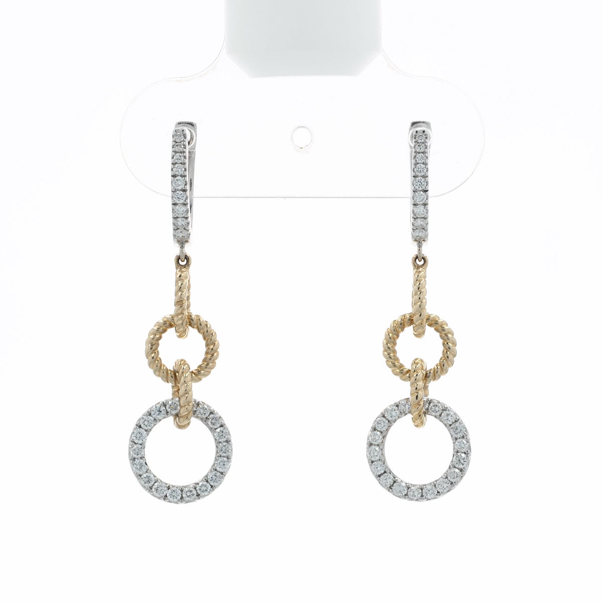 A video depicting pair of gold and silver drop earrings with pavé-set clear stones, featuring a textured rope-style ring, a smaller circular ring, and a larger pavé-set circular drop, at various angles on a white background with a soft reflection below.