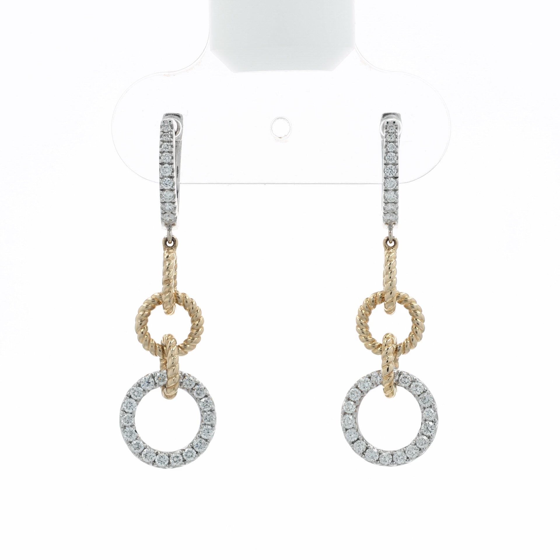 A video depicting pair of gold and silver drop earrings with pavé-set clear stones, featuring a textured rope-style ring, a smaller circular ring, and a larger pavé-set circular drop, at various angles on a white background with a soft reflection below.