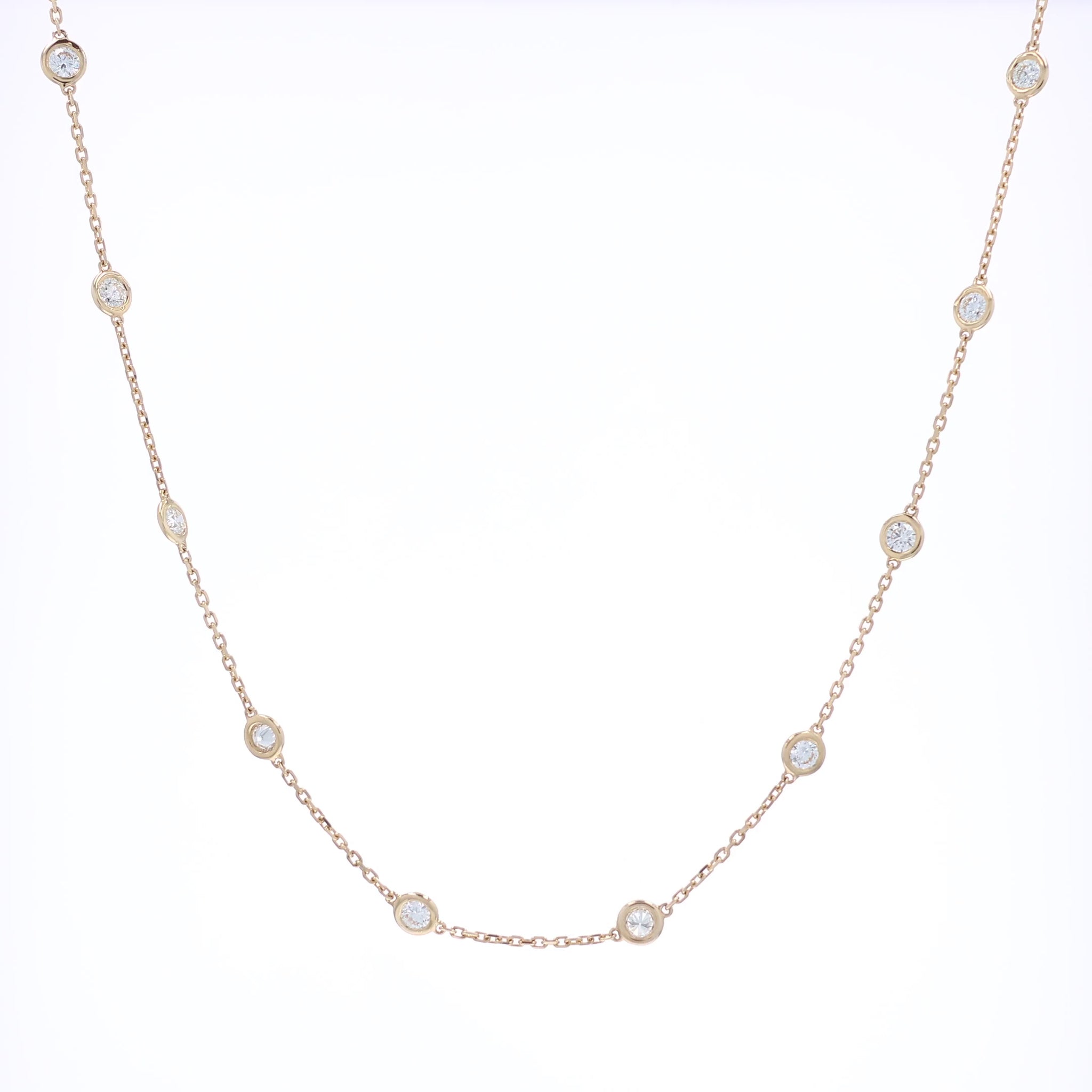 Yellow gold Diamonds By The Yard diamond station necklace on a white background