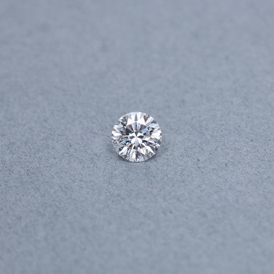 Round 2.00 carat GIA certified diamond graded DSI2 on a grey background
