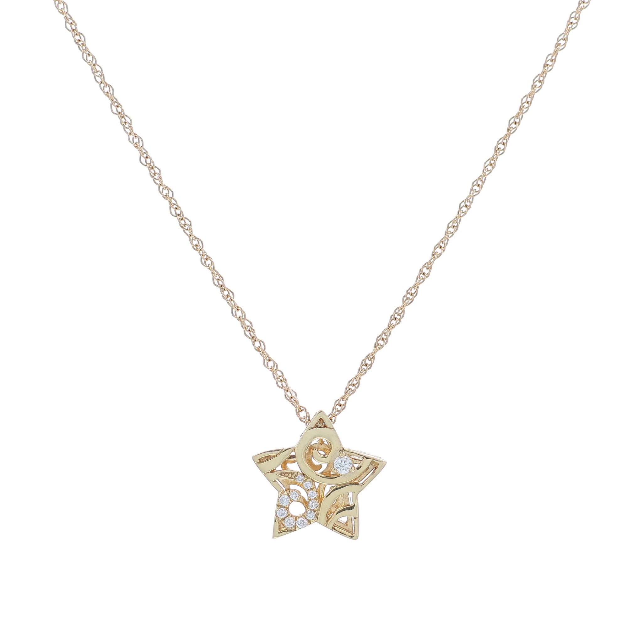 Yellow gold pave diamond swirl design filligree star charm necklace on a white background