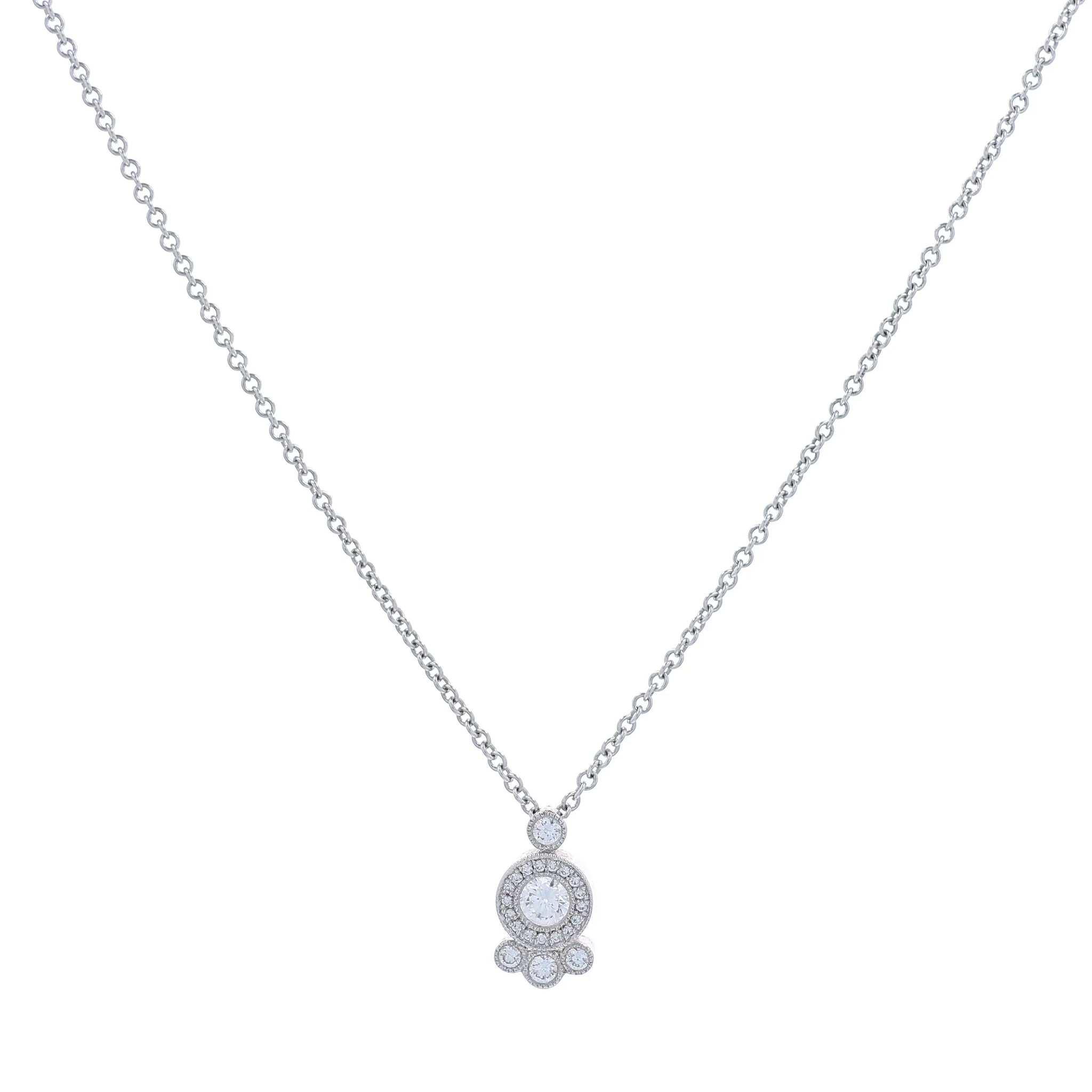 White gold abstract shape diamond halo pendant necklace on a white background