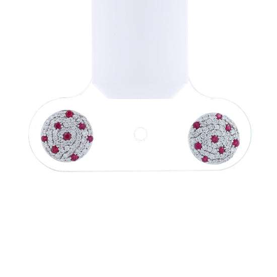 White gold round pave diamond and ruby stud earrings on a white background