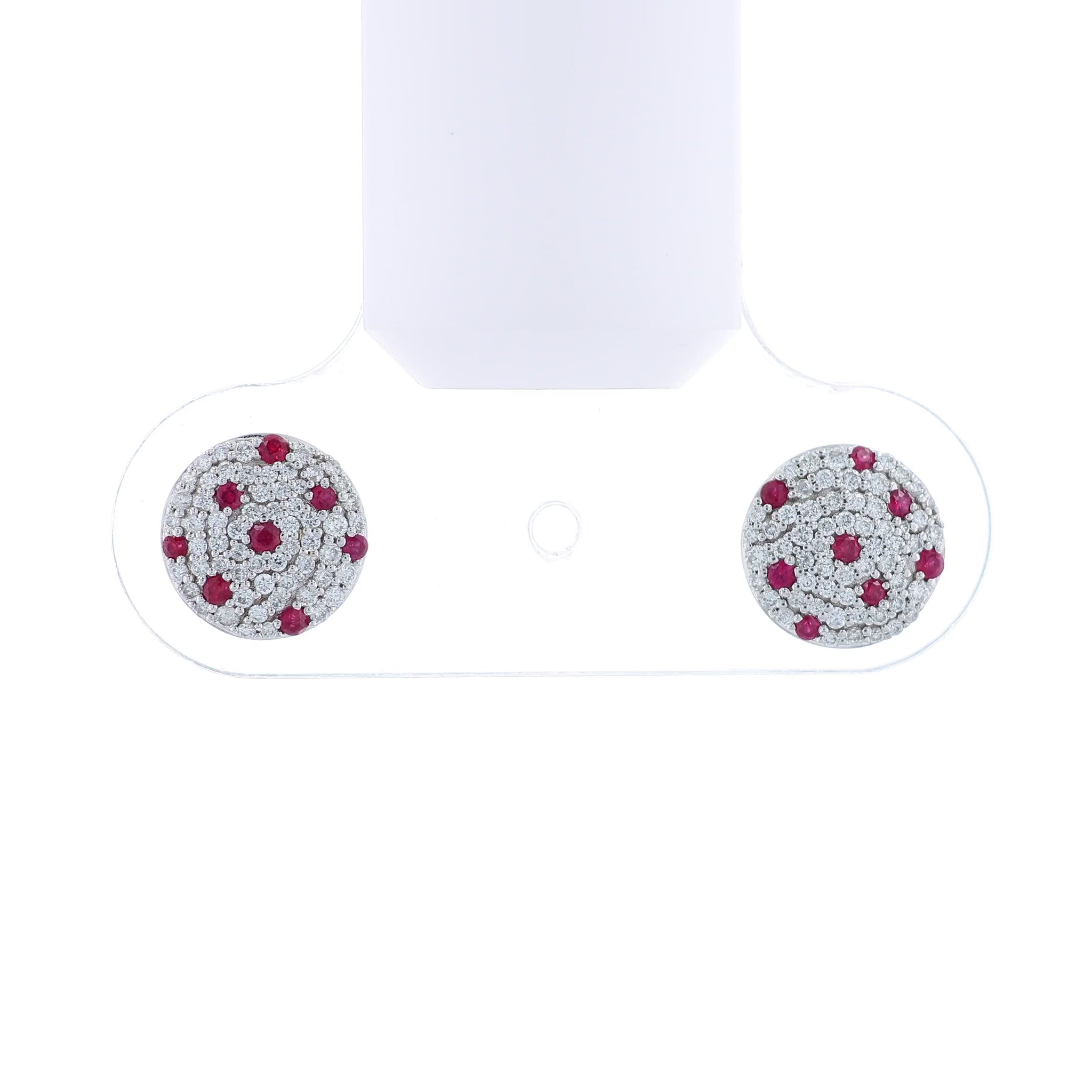 White gold round pave diamond and ruby stud earrings on a white background