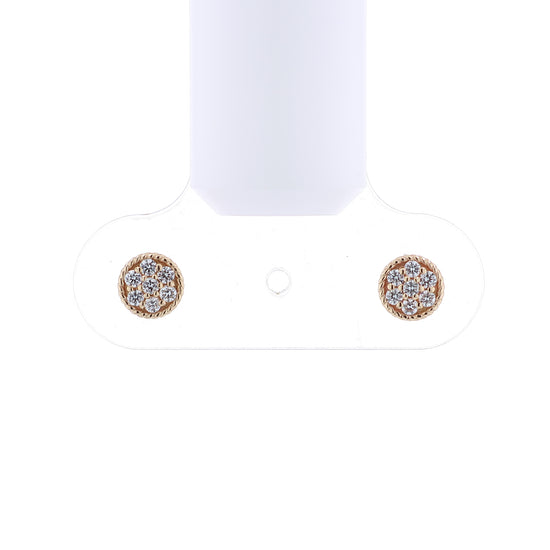 Yellow gold rope border pave diamond disc button stud earrings on a white background