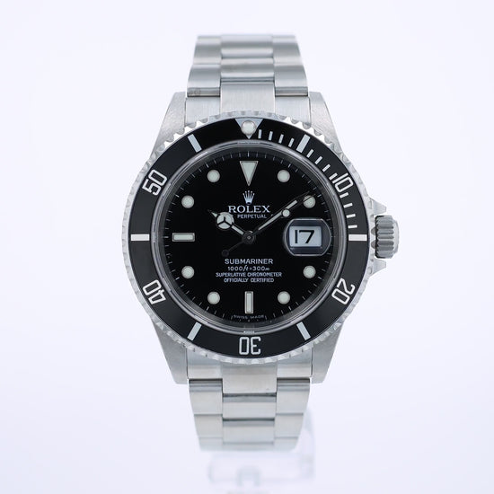 360degree video of a Rolex Submariner watch with a black bezel and dial and silver metal bracelet on a white background