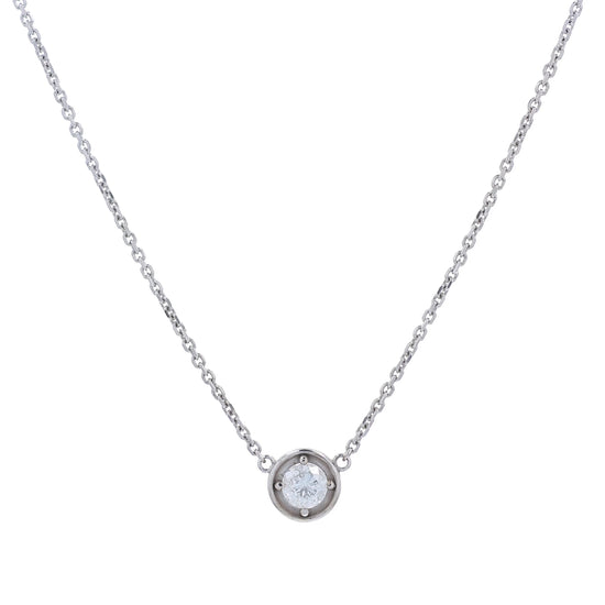 A delicate white gold chain necklace with a small round pendant holding a clear round-cut diamond, displayed against a solid white background.