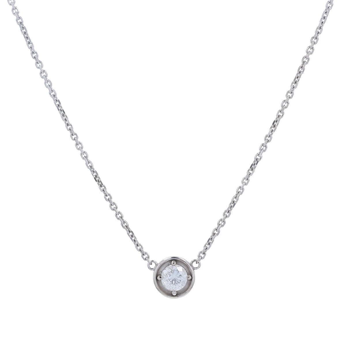 A delicate white gold chain necklace with a small round pendant holding a clear round-cut diamond, displayed against a solid white background.