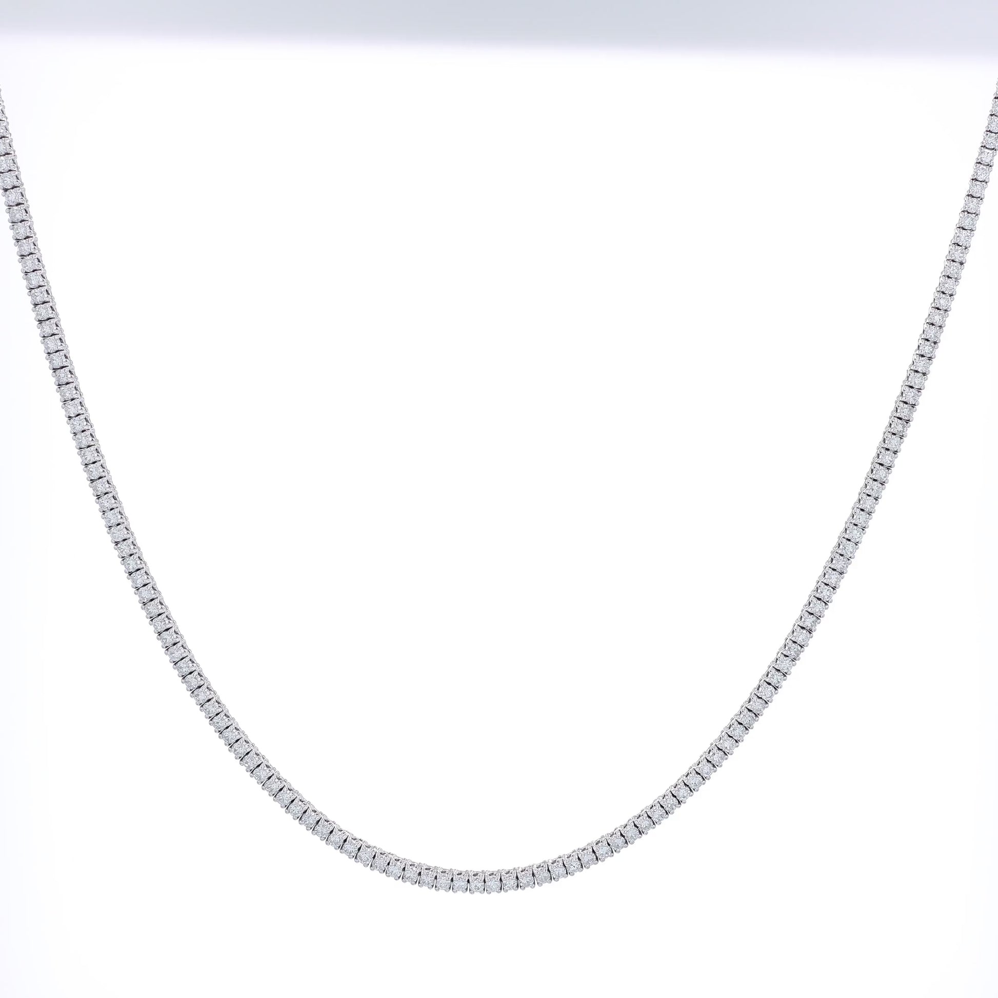 White gold 5.85 carat straight diamond tennis necklace graded HSI on a white background