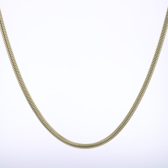 Polished Yellow gold tubogas chain necklace on a white background