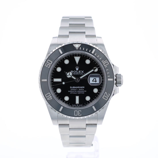 Back angle of a Rolex Submariner watch with a black dial and ceramic bezel on a white background