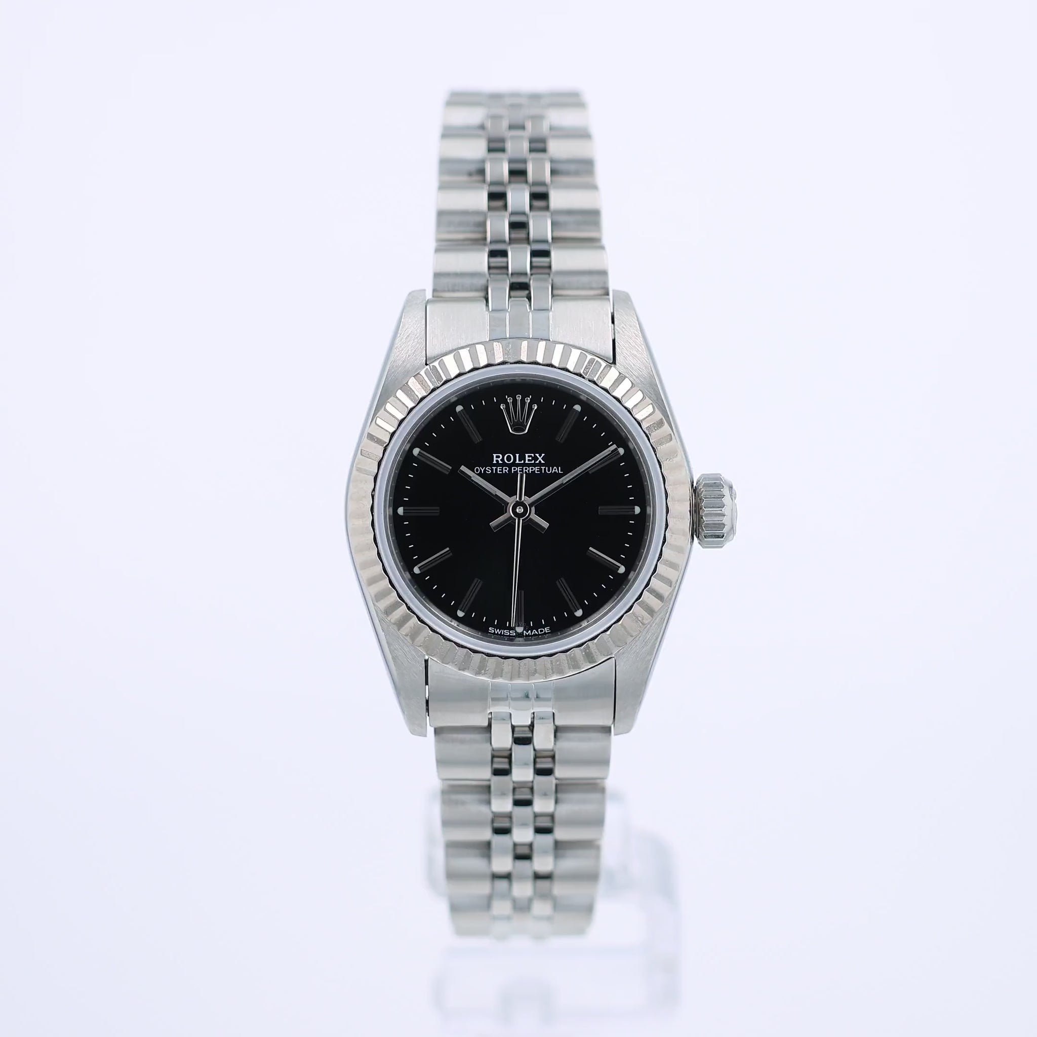 360 degree video of a silver Rolex watch with a black dial on a white background