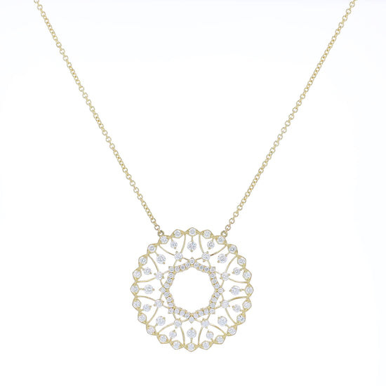 Yellow gold pendant necklace with diamond accents on a white background