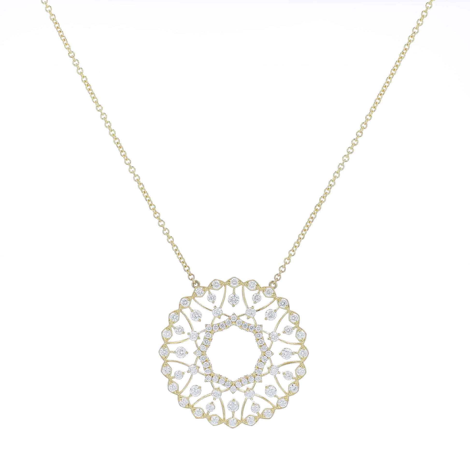 Yellow gold pendant necklace with diamond accents on a white background