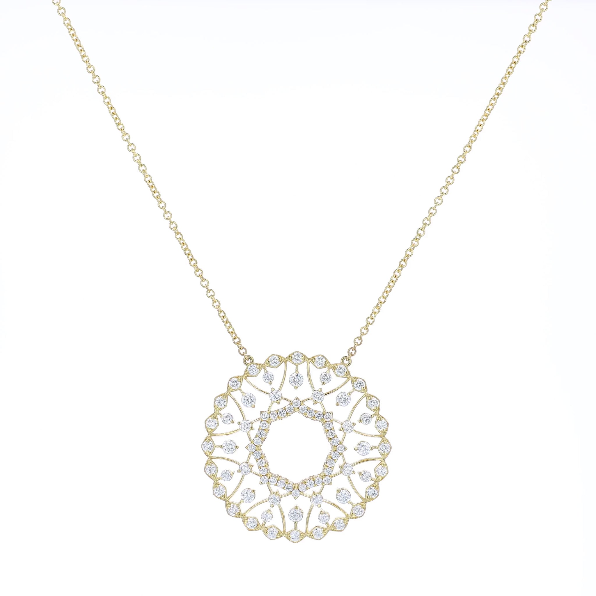 Yellow gold pendant necklace with diamond accents on a white background