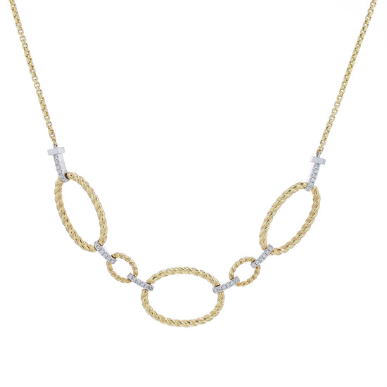 Yellow gold open oval twist link and pave diamond bar necklace on a white background