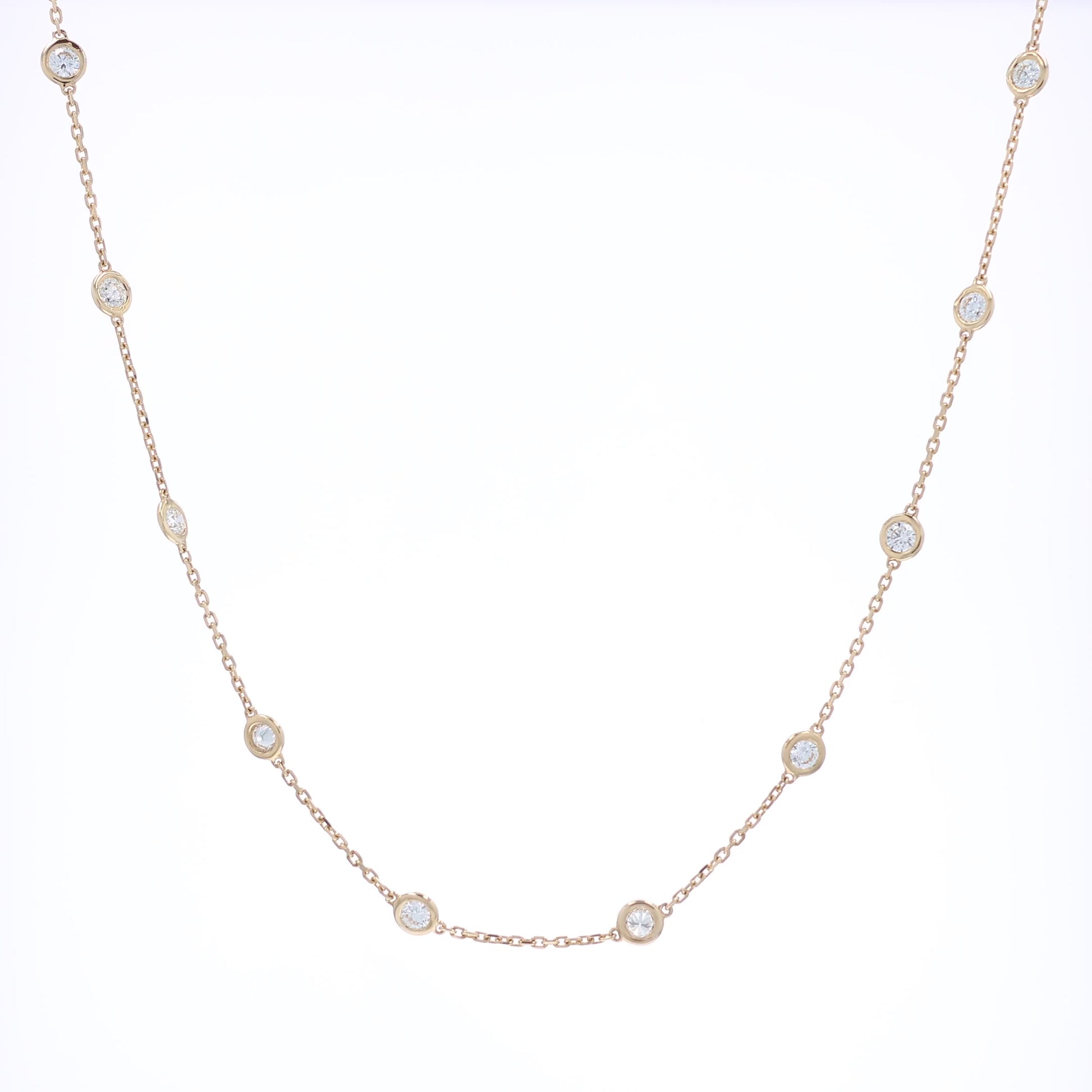 Yellow gold Diamonds By The Yard diamond station necklace on a white background