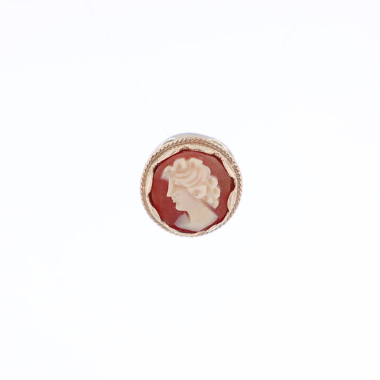 Yellow gold carved cameo slide pendant of a woman facing left on a white background