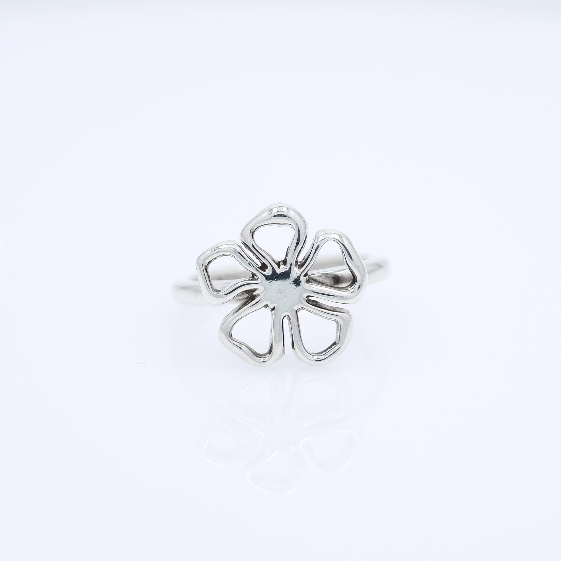 Silver Tiffany & Co open flower design ring on a white background