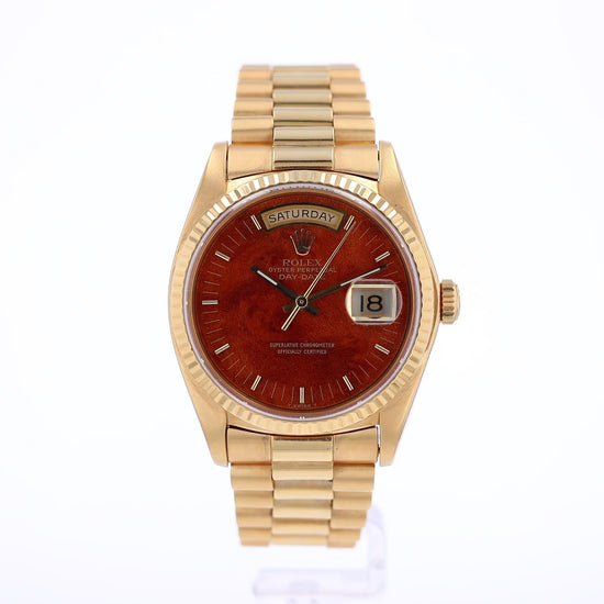 360 degree video of a vintage 18k yellow gold Rolex Day-Date watch with a walnut wood dial featuring gold indexes and hands on a white background