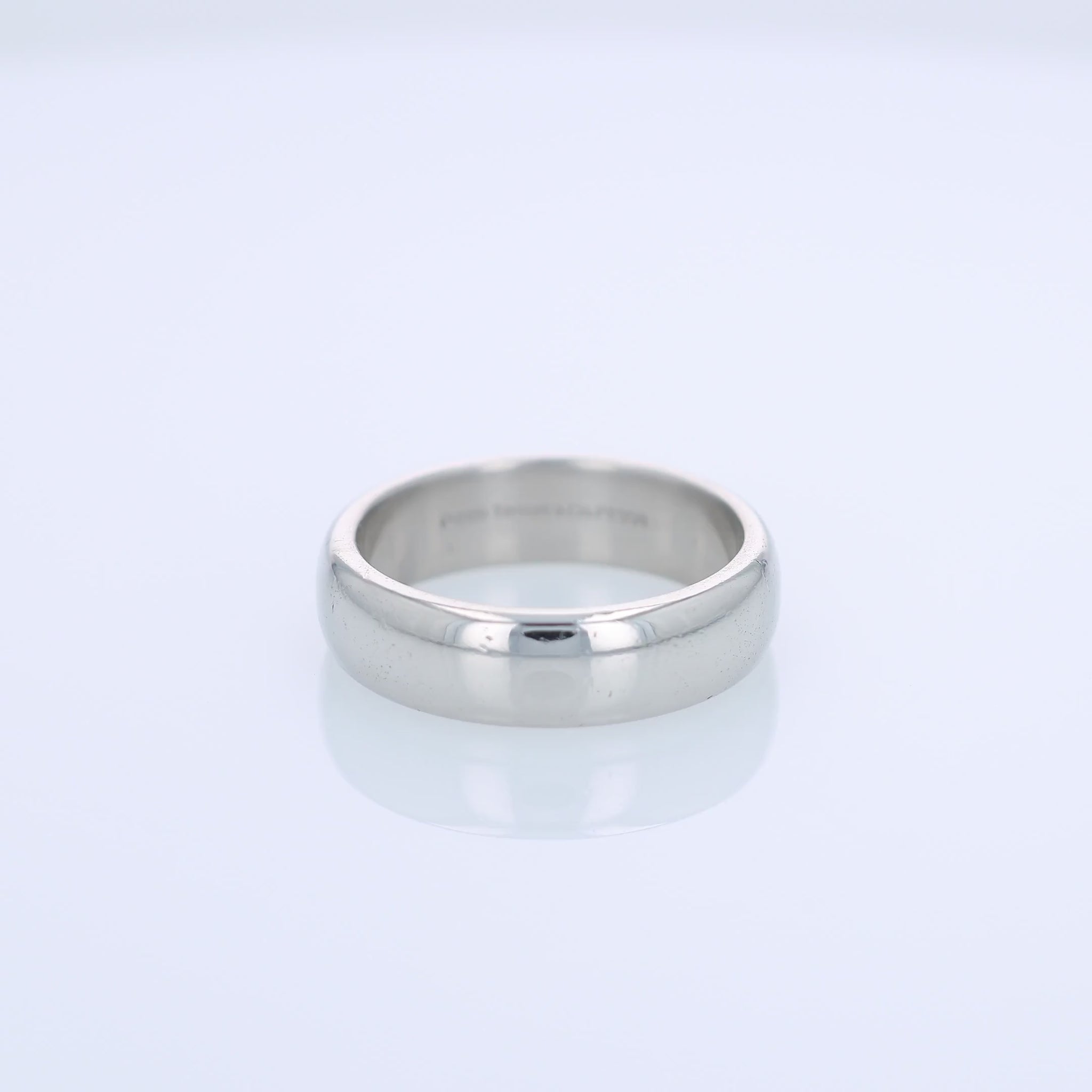 360 degree video of a Tiffany & Co platinum wedding band on a white background