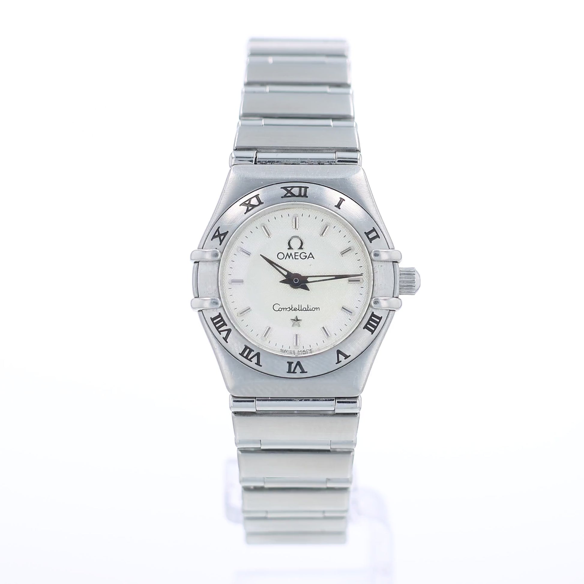 360 degree video of a silver Omega watch with a white dial and a roman numeral bezel on a white background