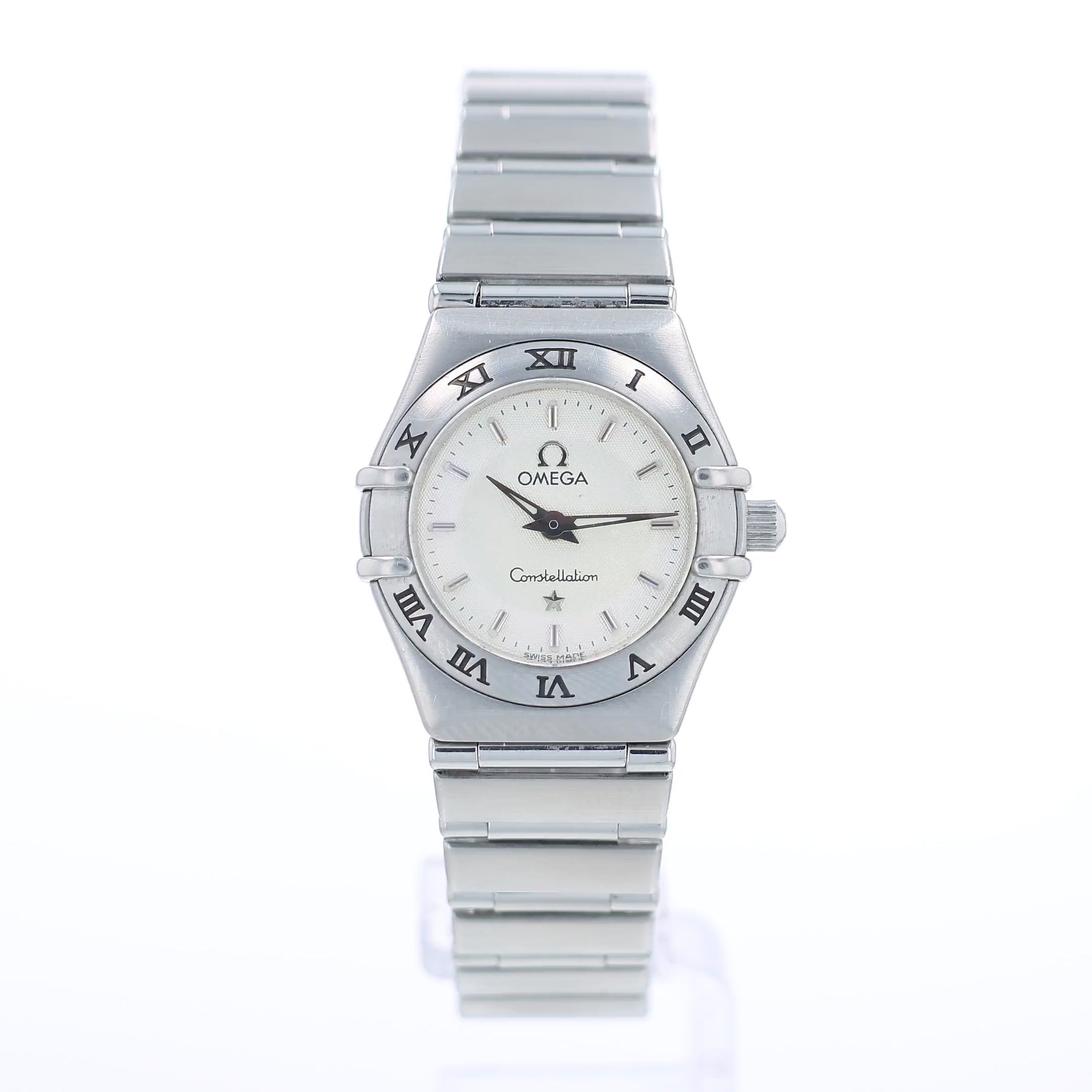 360 degree video of a silver Omega watch with a white dial and a roman numeral bezel on a white background