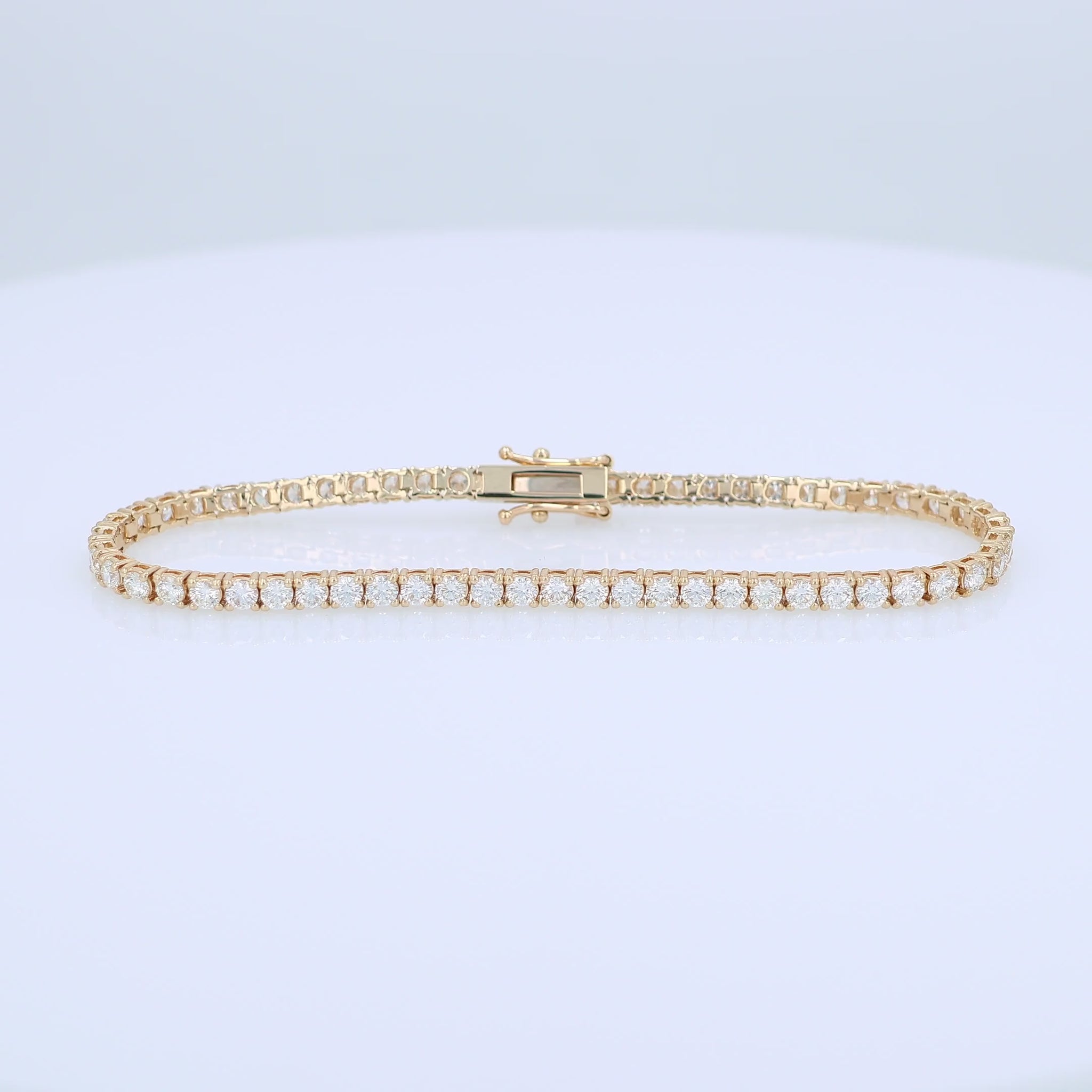 Yellow gold 4.27 carat diamond tennis bracelet on a white background
