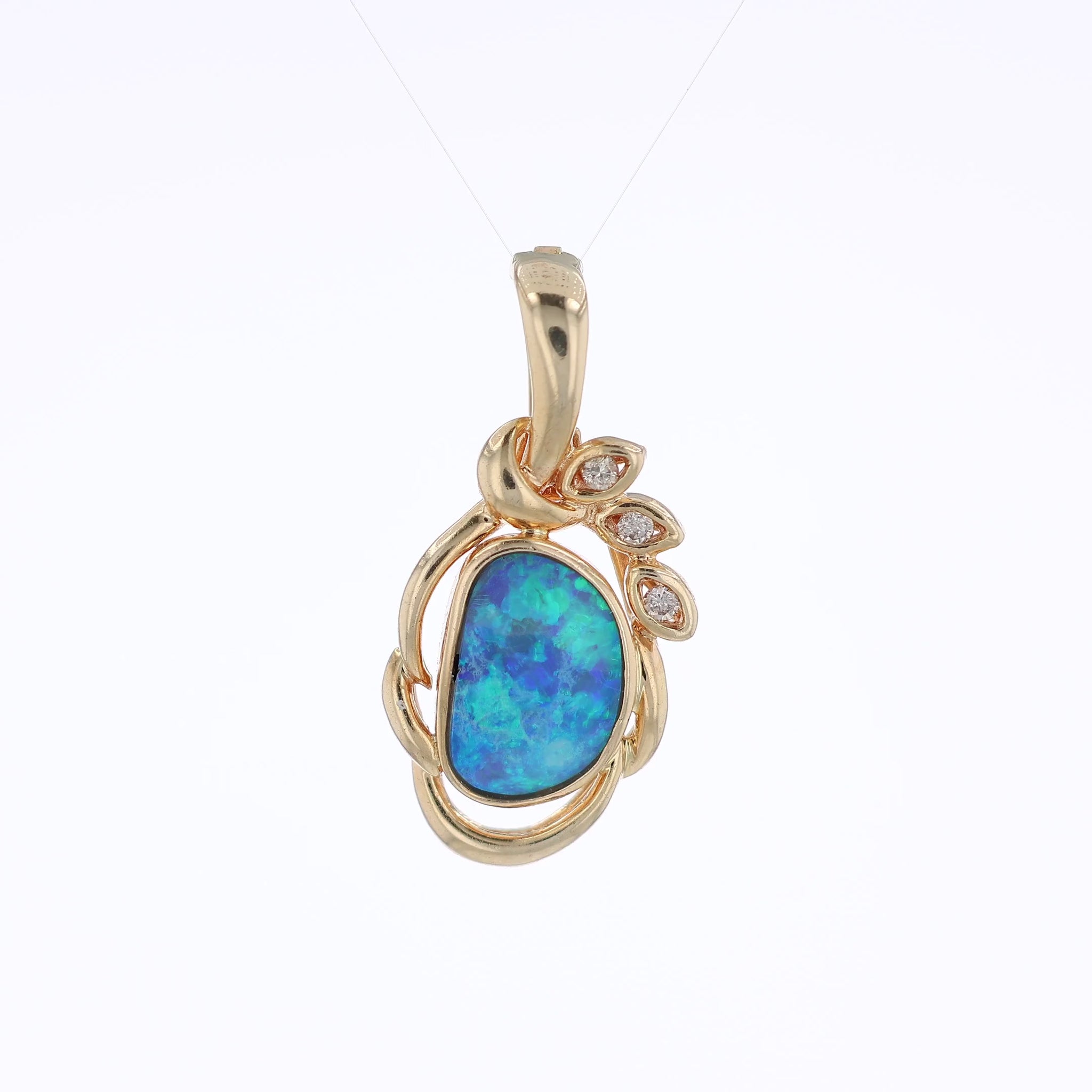 Yellow gold freeform opal and diamond enhancer pendant on a white background