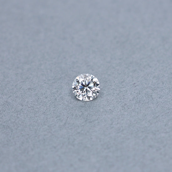 Round 1.51 carat GIA certified diamond graded HVS1 on a grey background