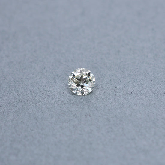 Old european 1.48 carat diamond graded MVS2 on a grey background