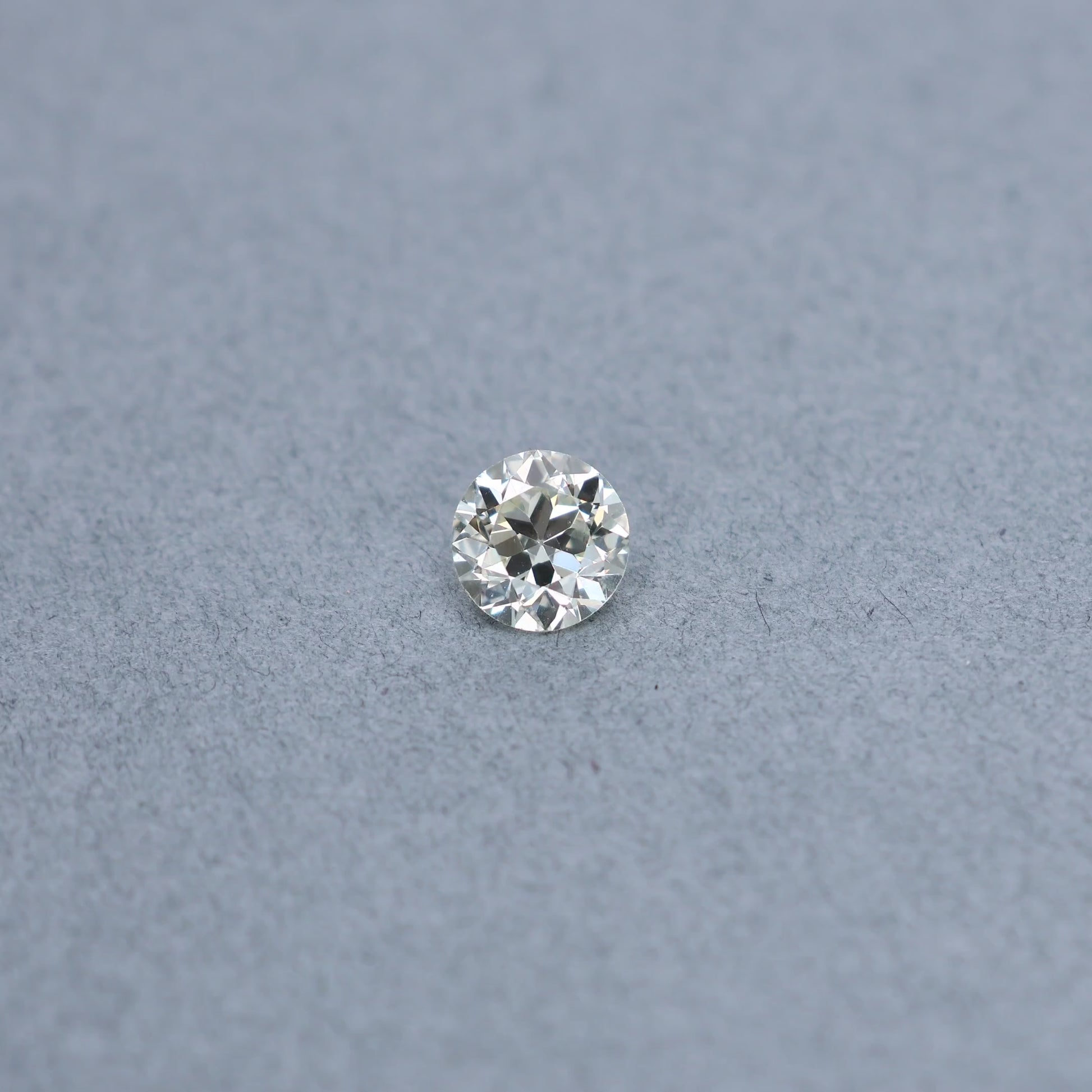 Old european 1.48 carat diamond graded MVS2 on a grey background