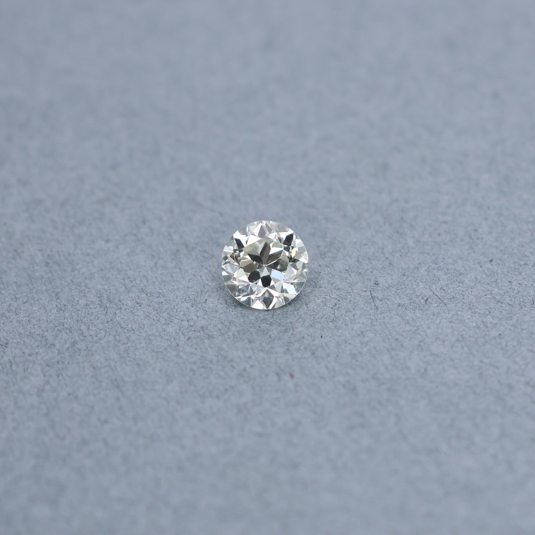 Old european 1.48 carat diamond graded MVS2 on a grey background