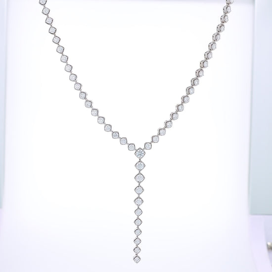White Gold diamond lariat necklace on a white background