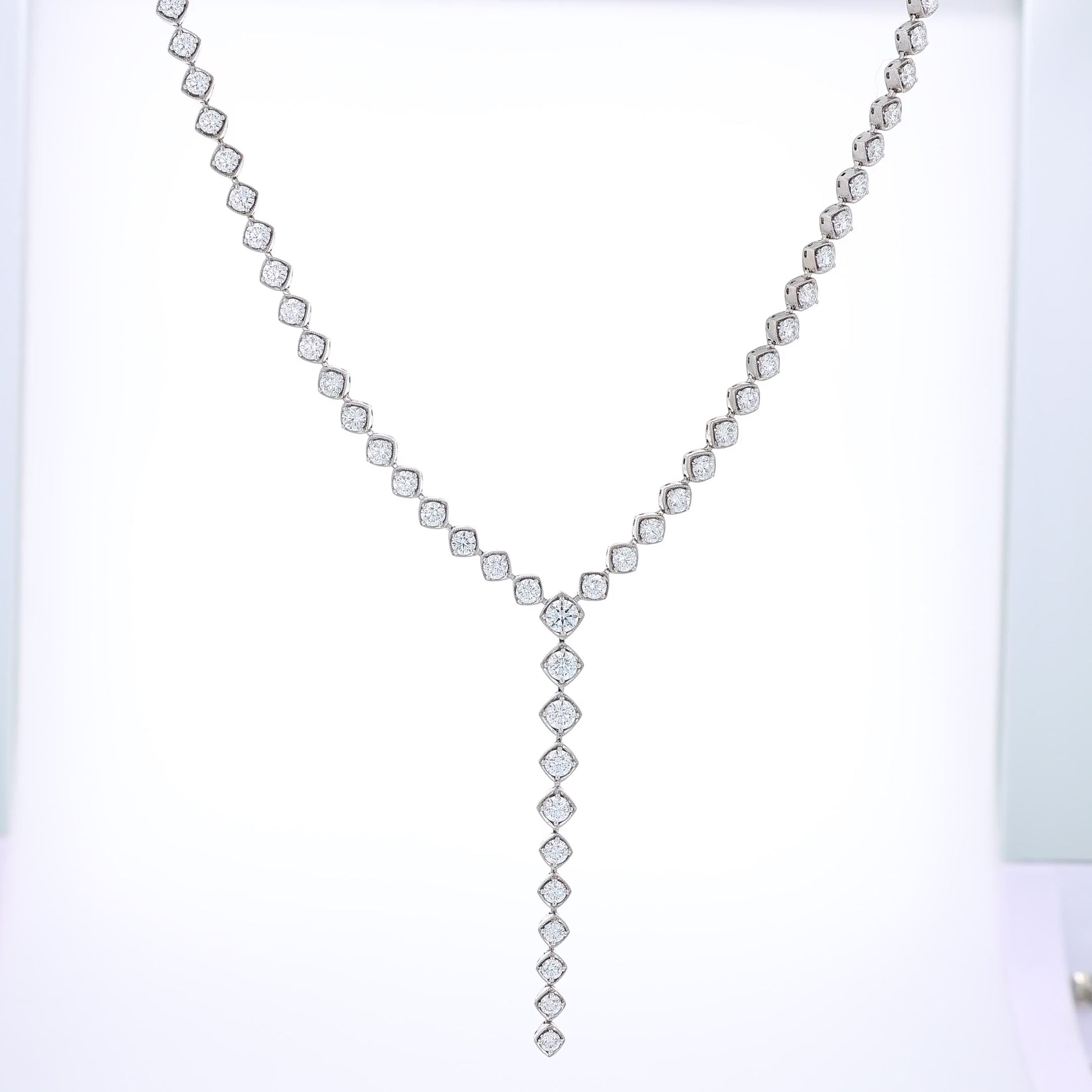 White Gold diamond lariat necklace on a white background