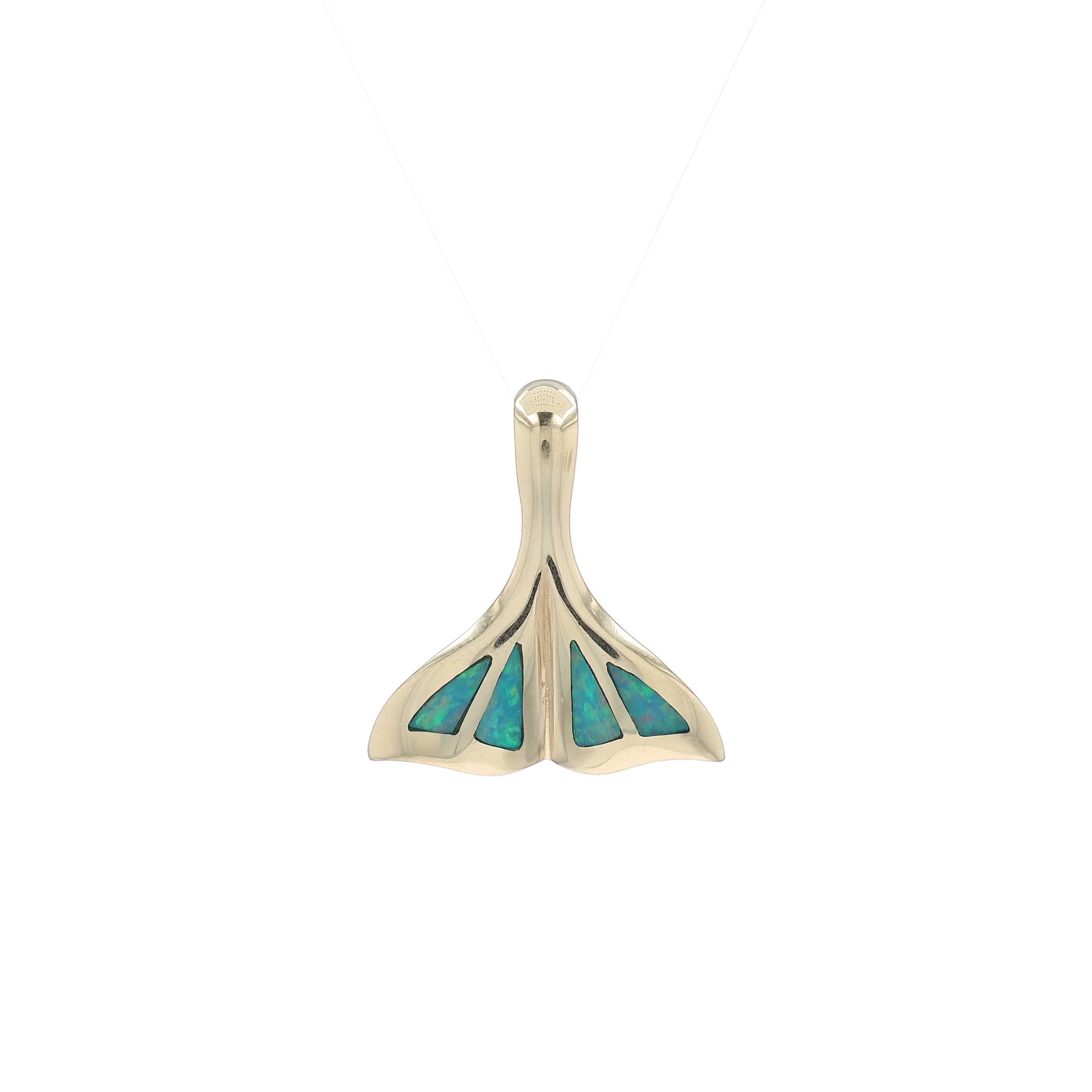 A video of a yellow gold whale tail design slide pendant with opal inlays on the tail, shown on a white background