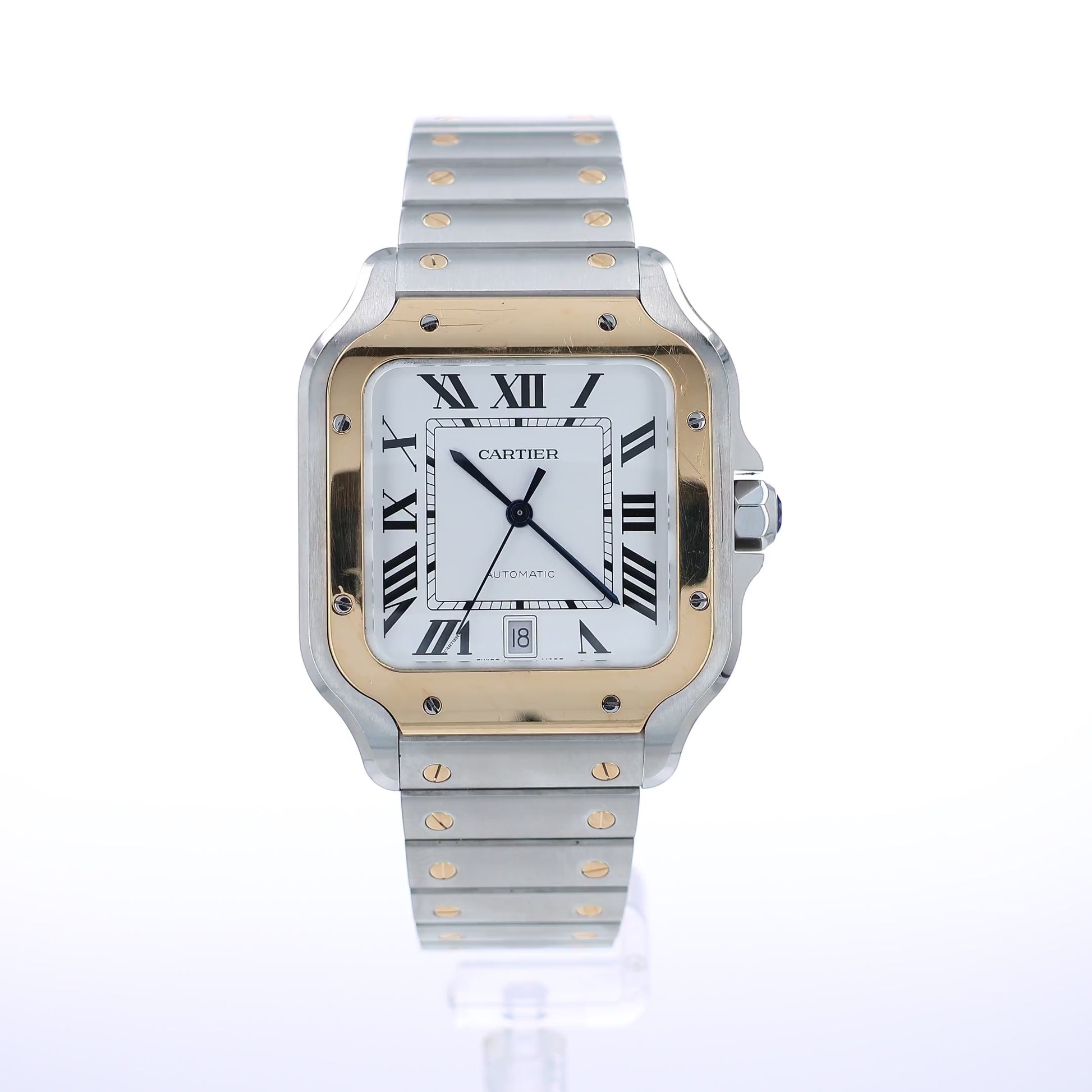 A video of a Cartier stainless steel and yellow gold automatic watch with a silver dial, Roman numeral hour markers, and a matching two-tone metal bracelet, shown against a plain white background.
