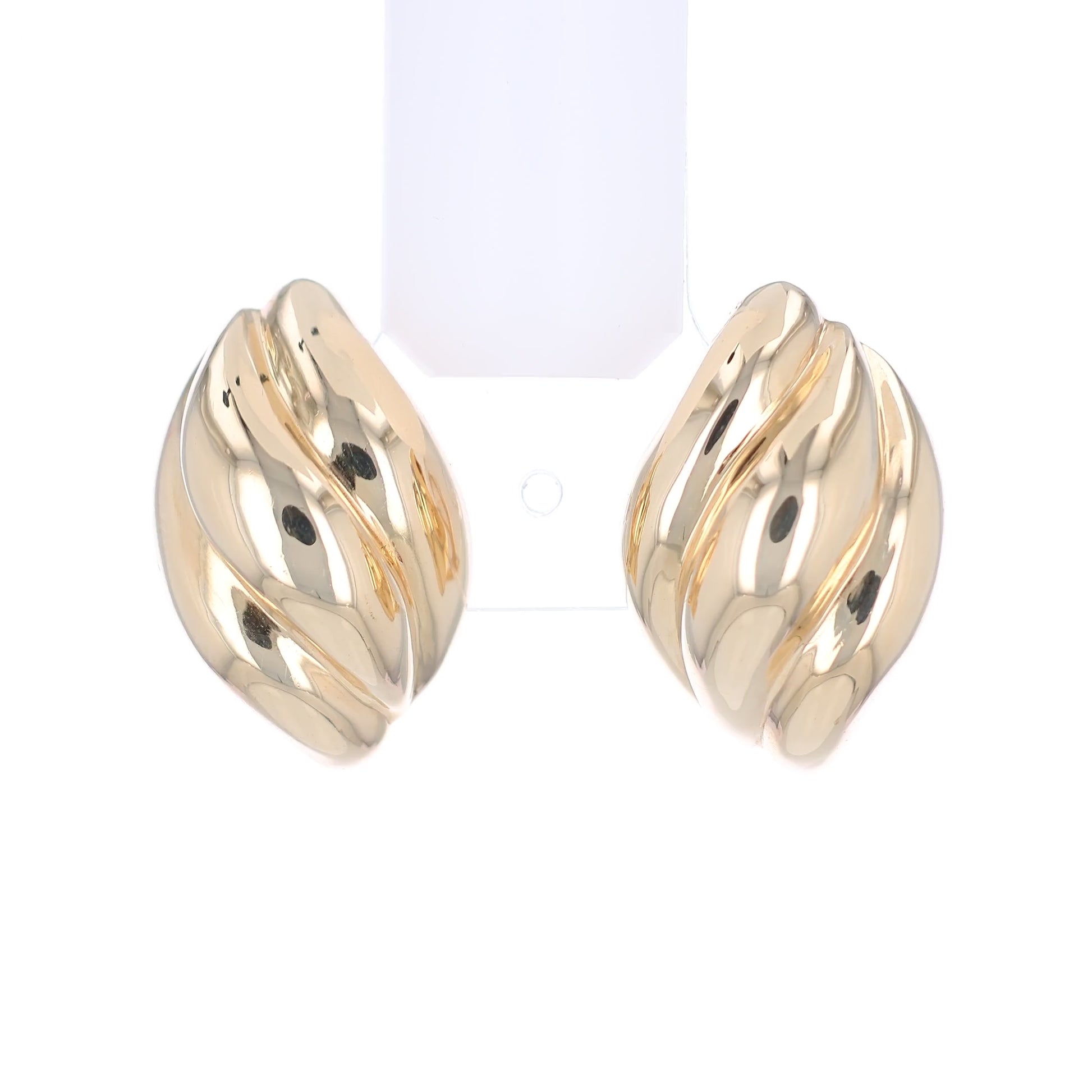 Gold tapered ribbed design earrings on a white background