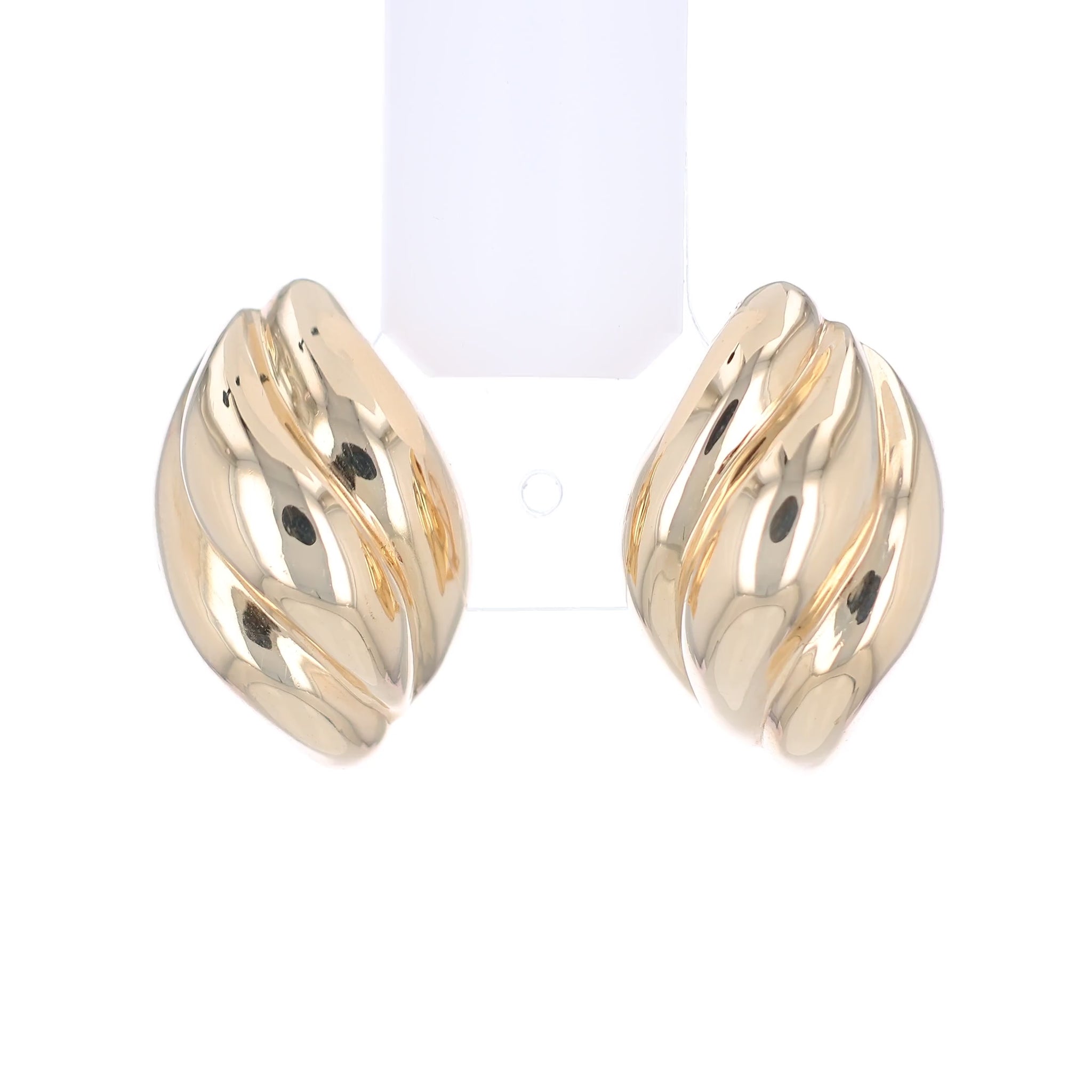 Gold tapered ribbed design earrings on a white background