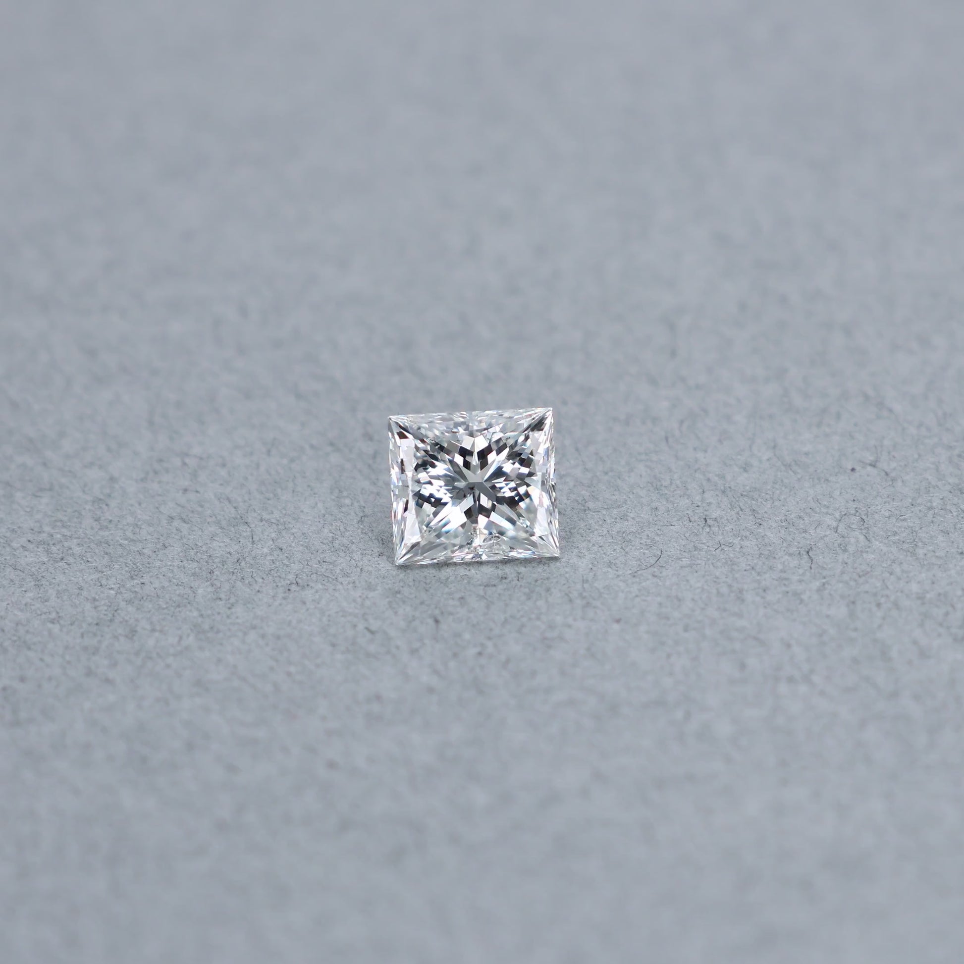Princess cut 2.01 carat diamond graded GSI2 on a grey background