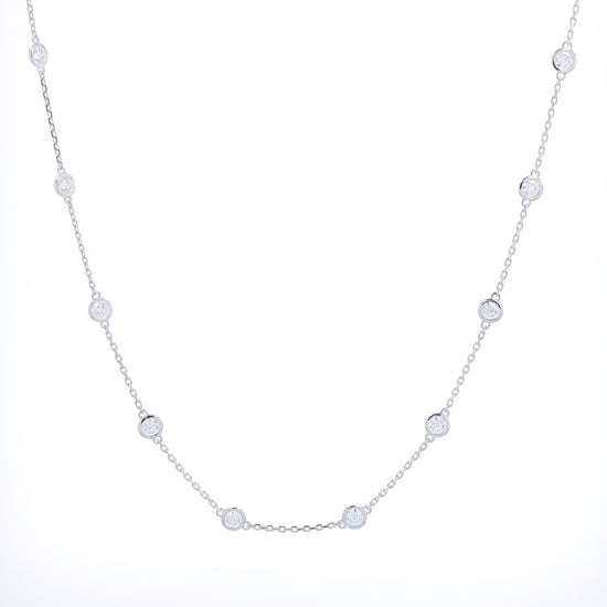 White gold bezel set Diamonds By The Yard necklace on a white background