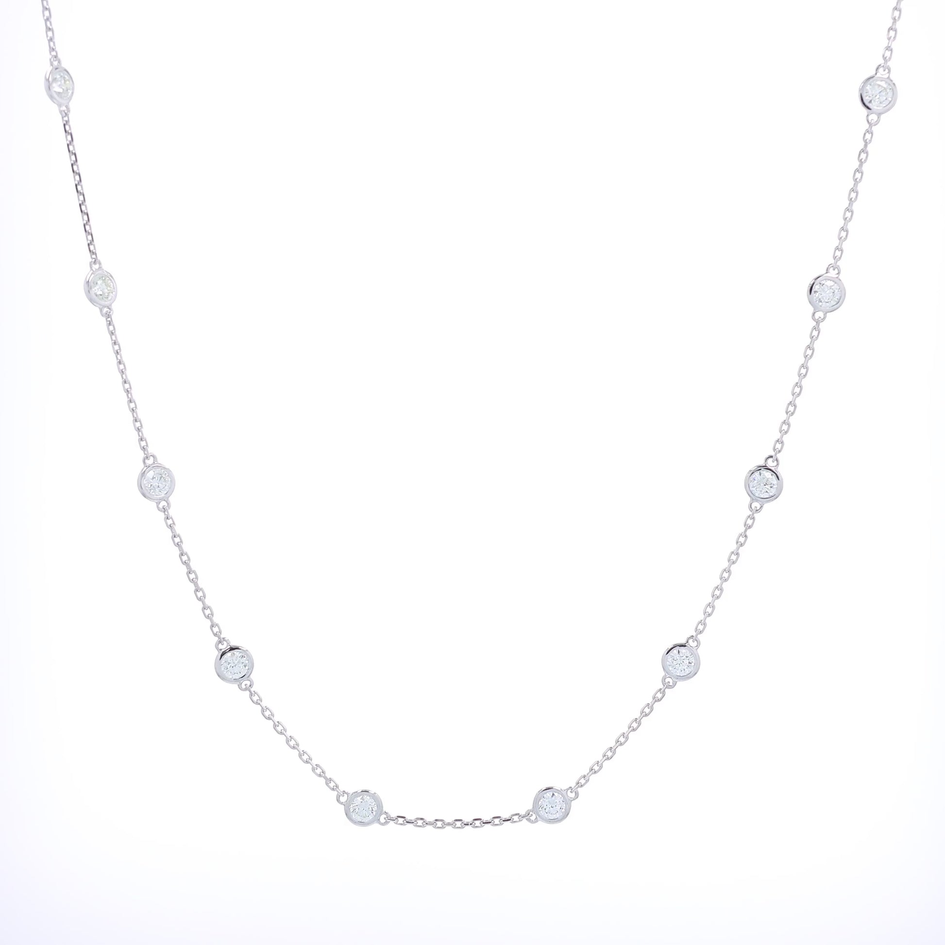 White gold bezel set Diamonds By The Yard necklace on a white background