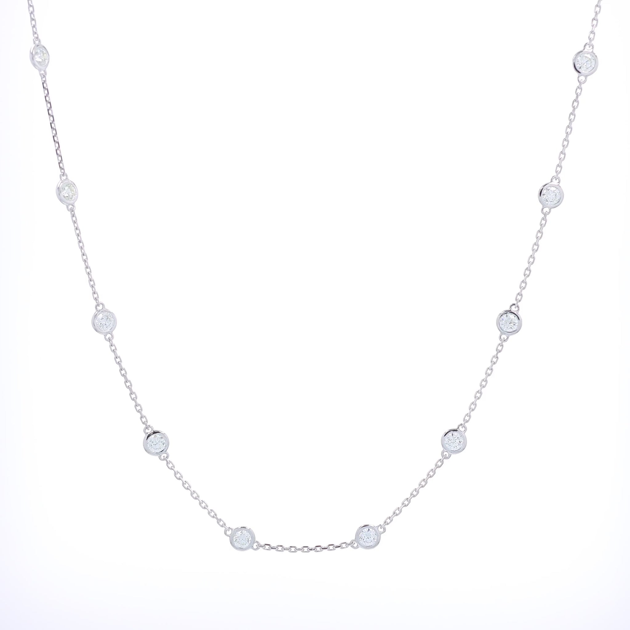 White gold bezel set Diamonds By The Yard necklace on a white background