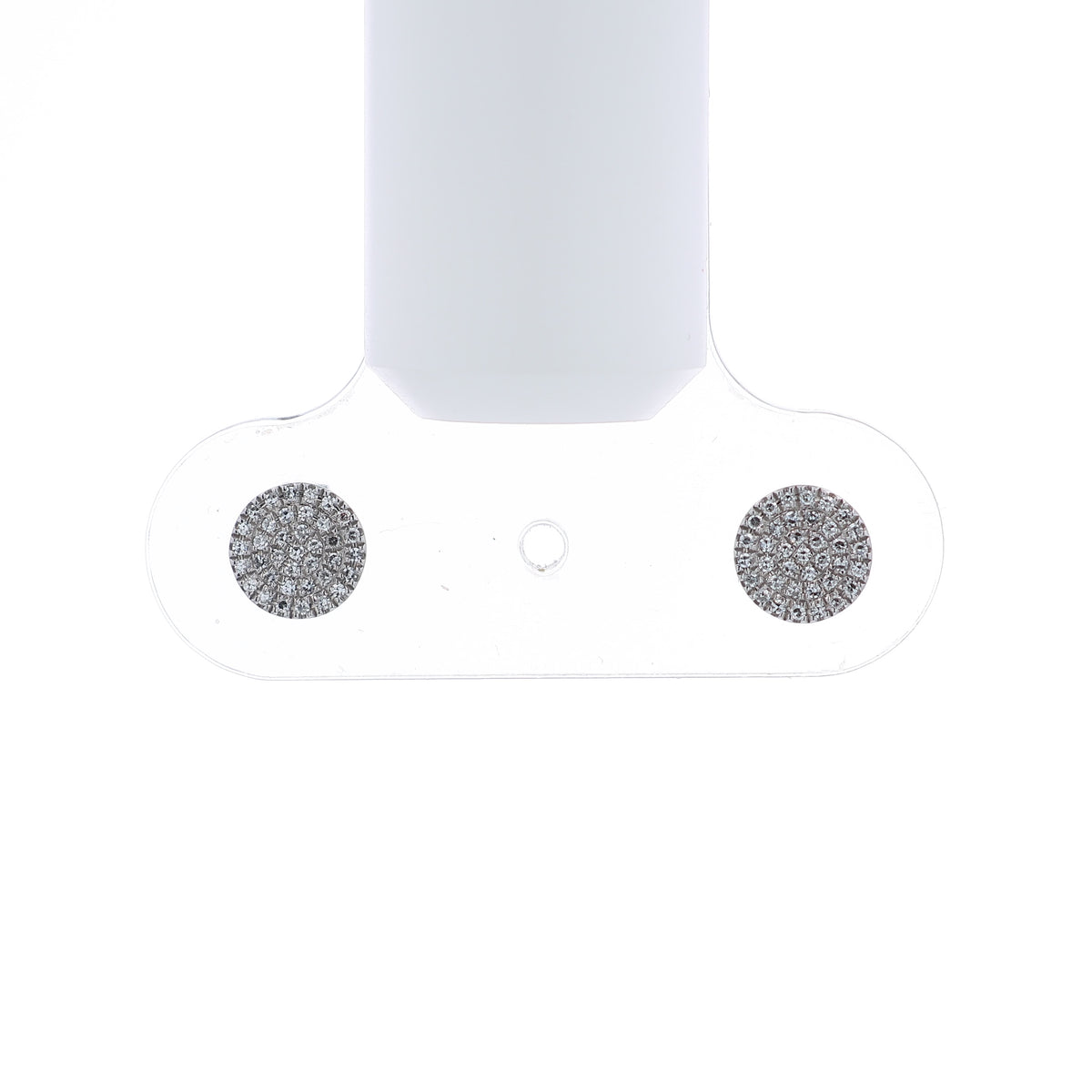 A pair of round pavé diamond stud earrings in white gold on a white background