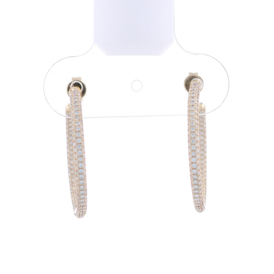 Yellow gold inside & out pave diamond hoop earrings on a white background